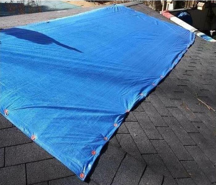 blue tarp on roof